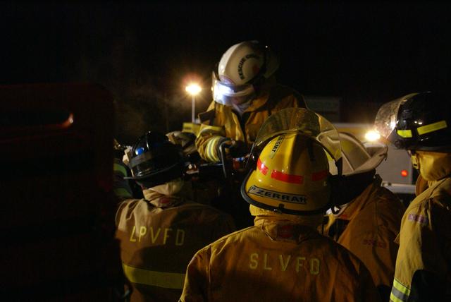 Rescue Chief Julie Harjung uses &quot;cutters&quot; to cut the drivers side &quot;B-Post&quot; to remove the roof to access the Patient. &quot;NYS Accident Victim Extrication Course 12/29/2011&quot;